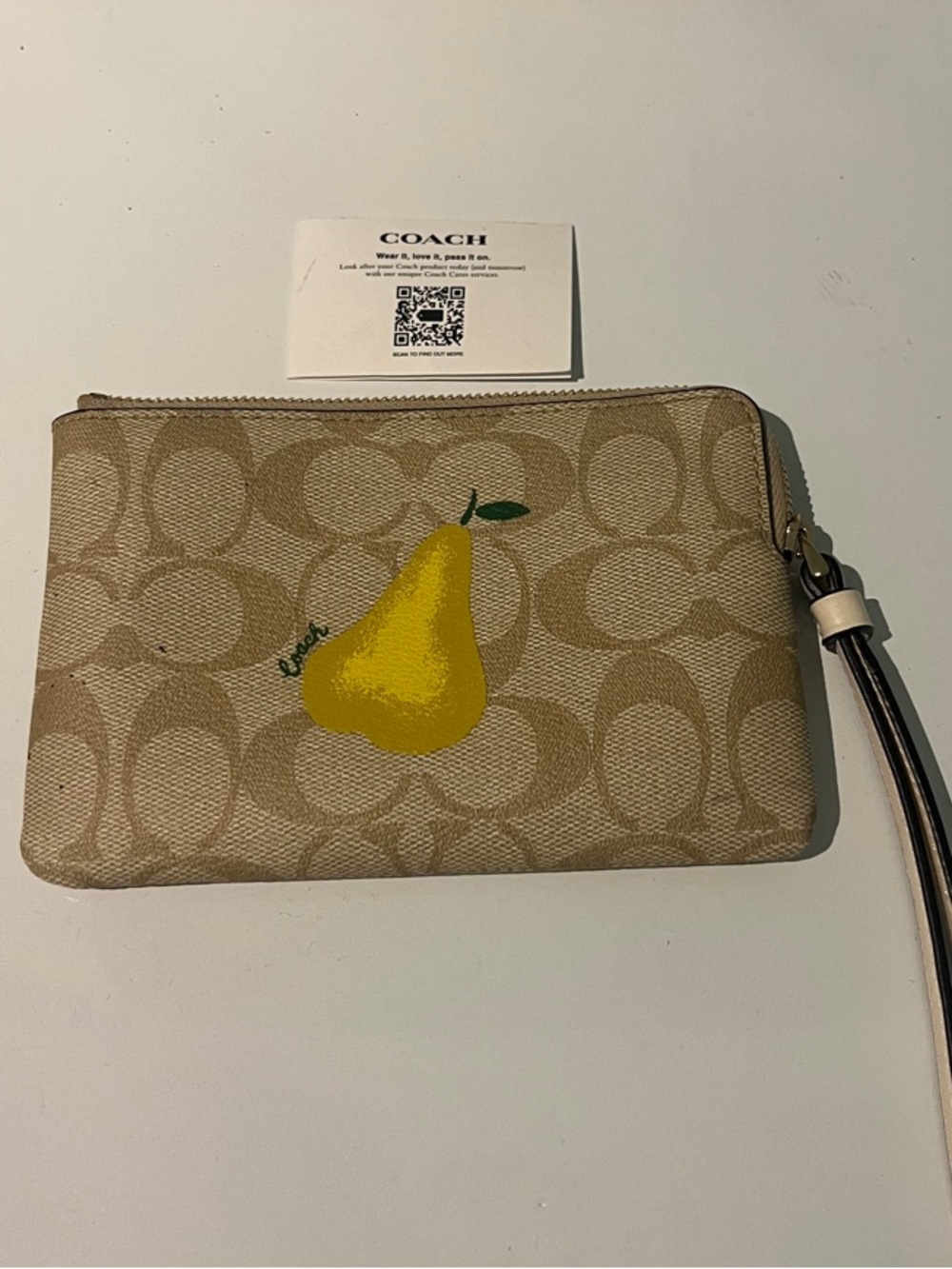 Coach Beige Signature Wristlet with Yellow Pear Motif
